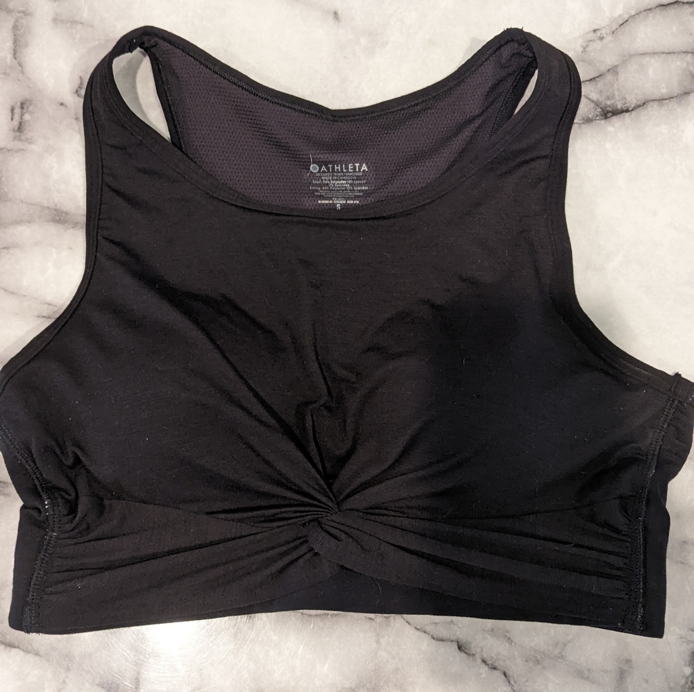 Athleta sports bra with front touching in black. Size M.